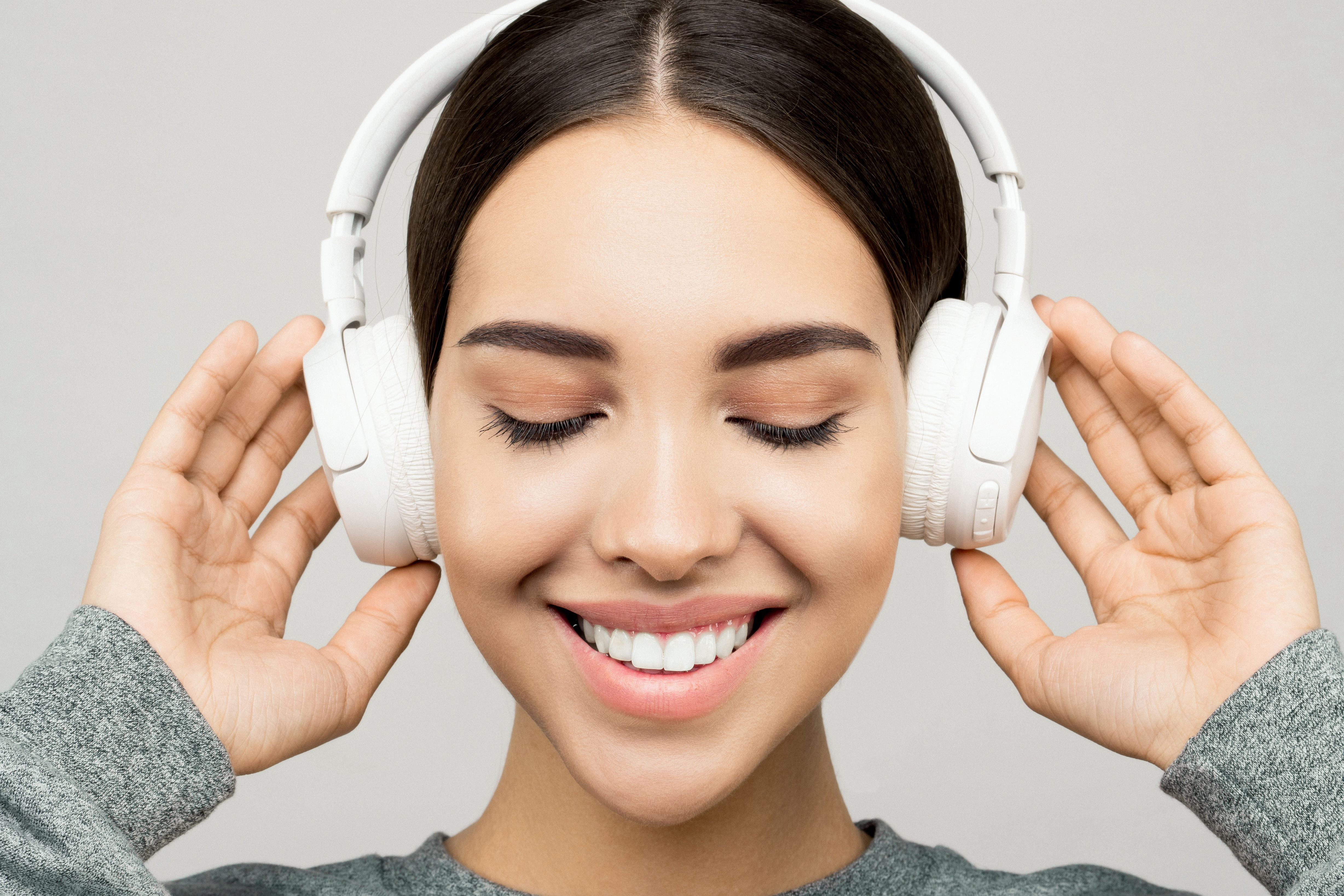 A picture of a woman with headphones on